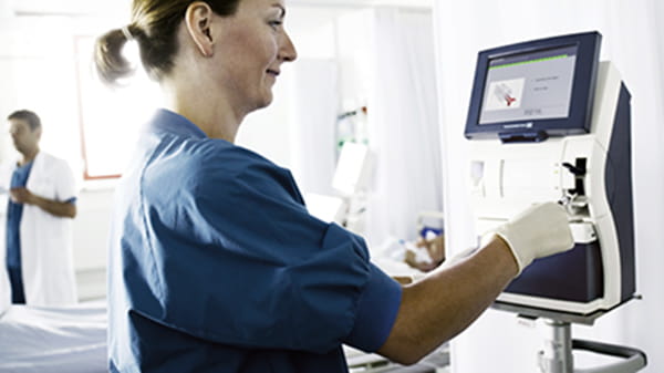 Nurse with ABL90 FLEX blood gas analyzer