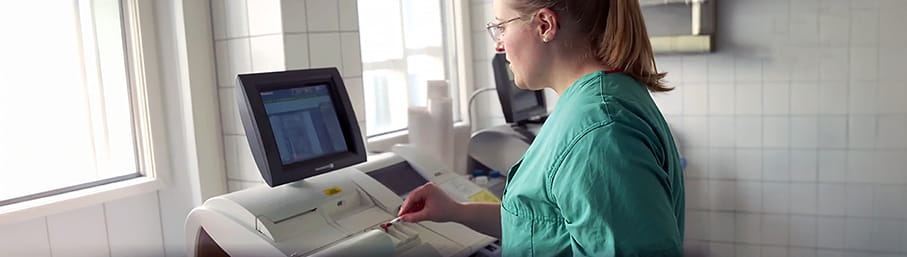 Erlangen hospital - nurse performing a blood gas test on the ABL800 blood gas analyzer