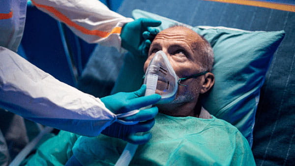 Patient wearing an oxygen mask