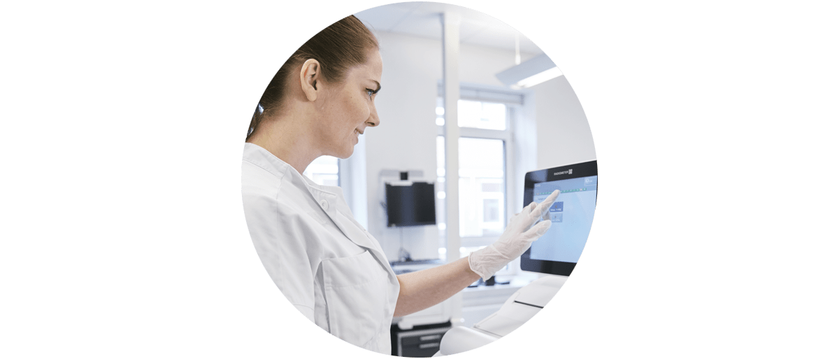 Hospital staff with ABL800 blood gas analyzer.